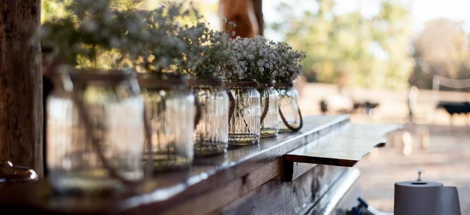 Find inspiration for your own wedding or corporate event with everyday items like mason jars filled with baby's breath! 