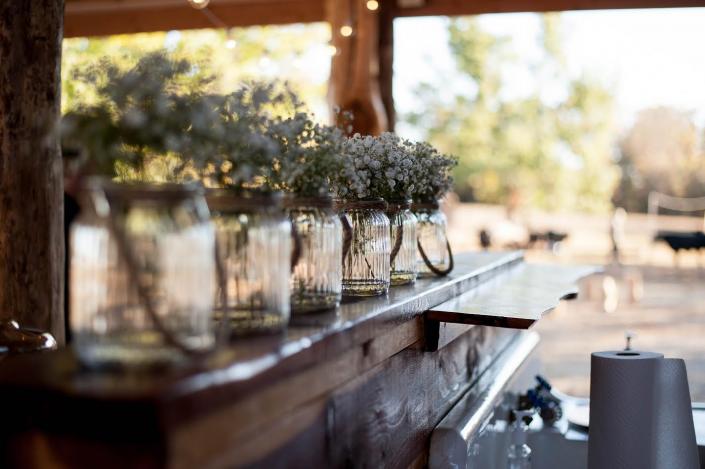 Find inspiration for your own wedding with everyday items like mason jars filled with baby's breath! 
